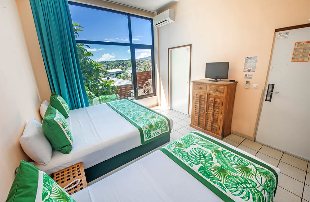 Tahiti Airport Hotel Chambre climatisée adpatée aux personnes à mobilité réduite Tahiti Airport Hotel Chambre climatisée adaptée aux PMR